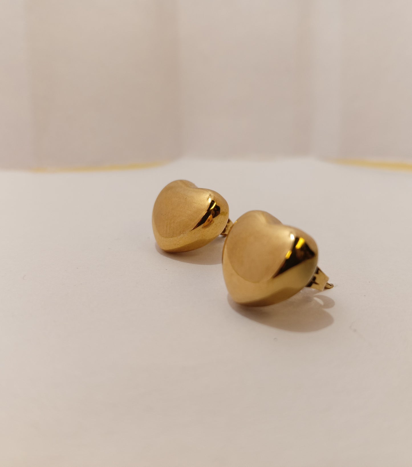 Heart-shaped gold Studs